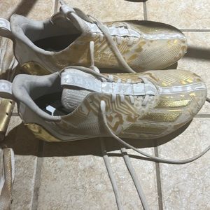 Football cleats and gloves. Worn for five days of practice.